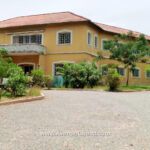 Executive House with 3 bedroom outhouse & large storage on 4 Acres of land to let or lease at Osu in Accra Ghana